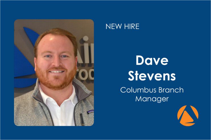 New Hire Dave Stevens Columbus Branch Manager | Air Control Products Portrait of a man with short hair and a beard, smiling, wearing a light gray jacket over a white collared shirt. The background features indistinct signage. On the right, text reads 'NEW HIRE Dave Stevens Columbus Branch Manager' on a blue background, with an orange logo at the bottom right.